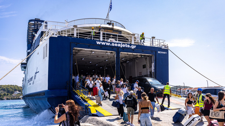 Passengers disembarking a ferry at the port of Skiathos, Greece
