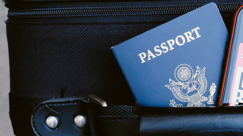 A U.S. passport on top of a suitcase