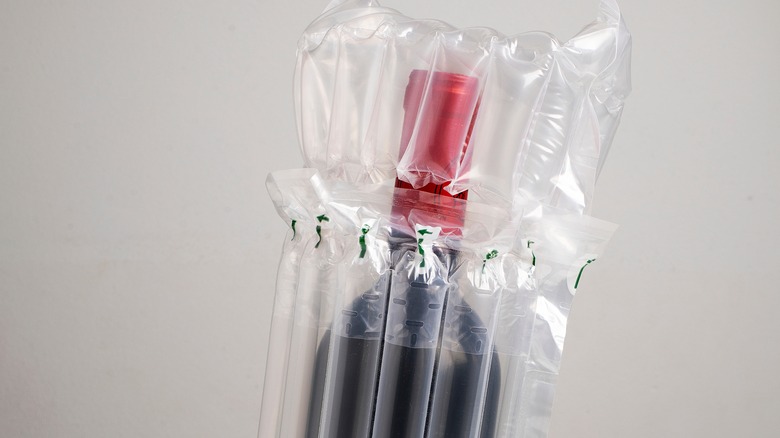 a bottle of wine in an inflatable travel sleeve.