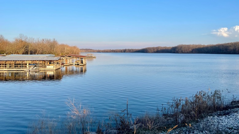 A view of Lake Fayetteville's docks and still, blue waters from the shore