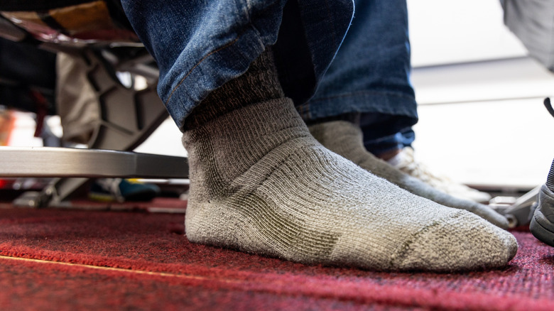Airplane passenger without shoes