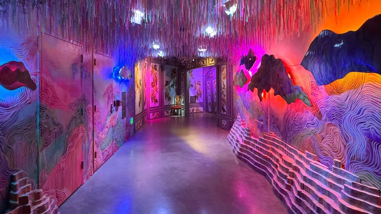 Trippy purple hallway at Meow Wolf Denver