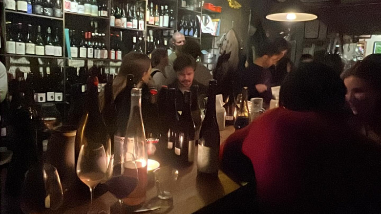 People drinking inside 107 Wine Bar