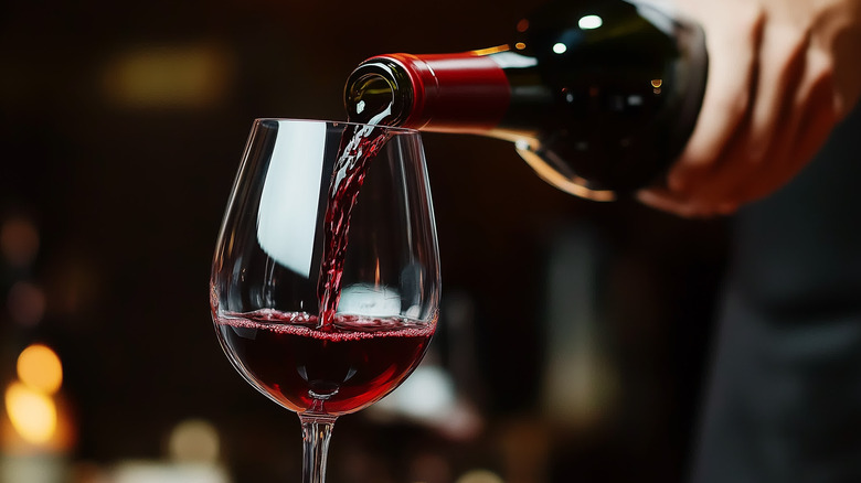 Red wine being poured into a glass