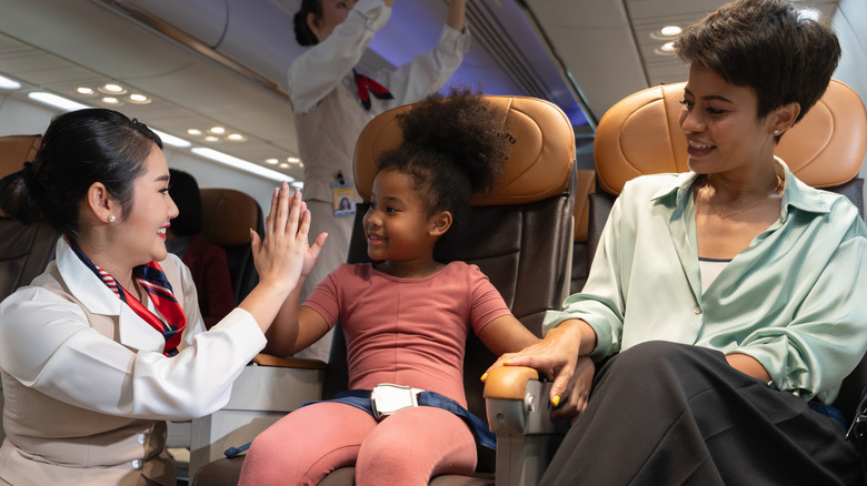 Flight attendant with child