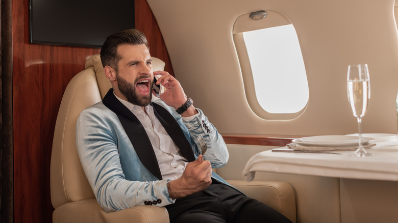 Rude passenger on an airplane