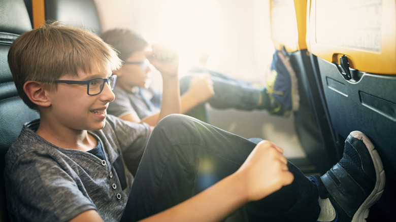 Kids being naughty on airplane