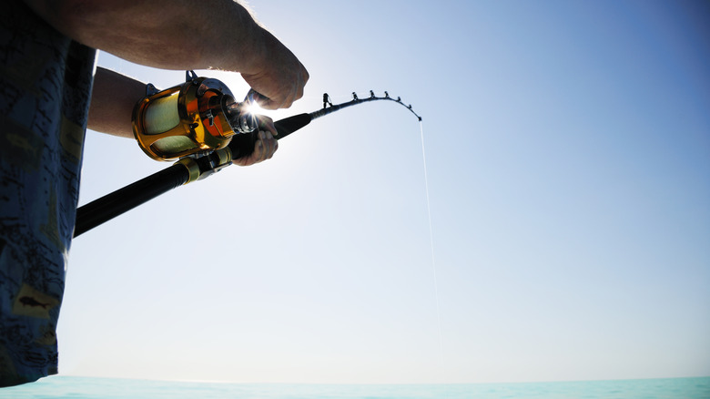 Man holding a fishing pole