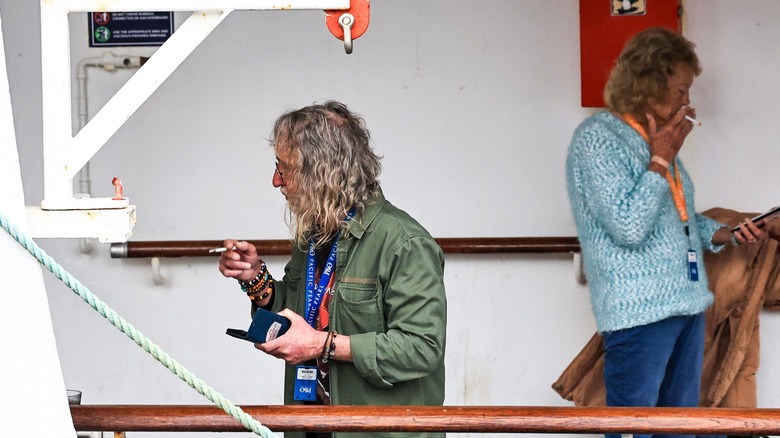 Two people smoking on a cruise