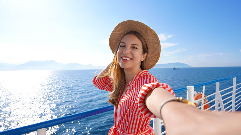 Woman taking selfie on cruise