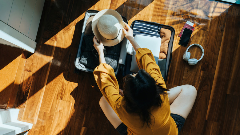 A woman packing her bag