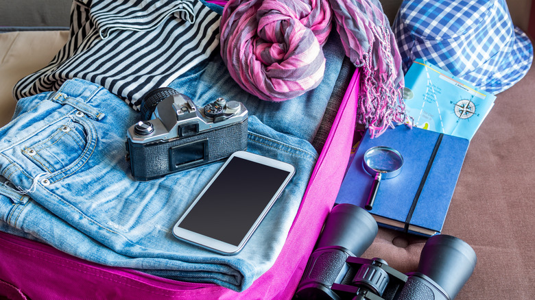 Packed suitcase with scarf