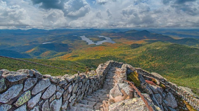Stone staircase leading down to open field views in Lake Placid