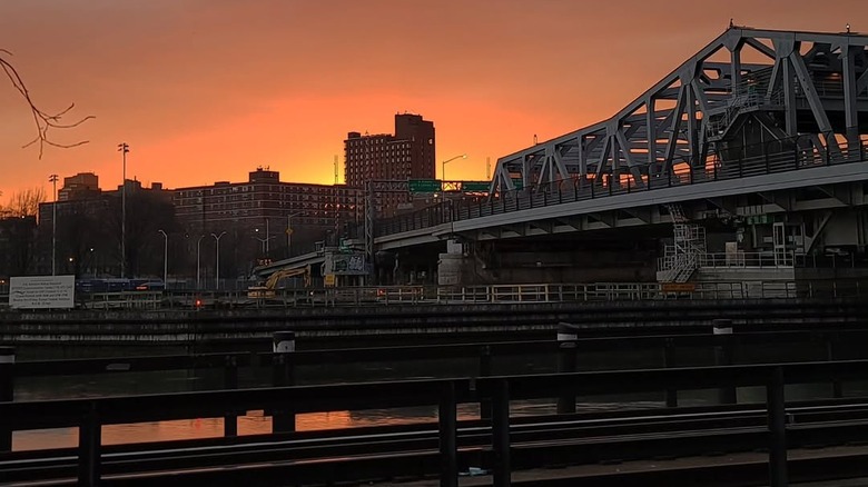 bridge and skyline in front of the sunset