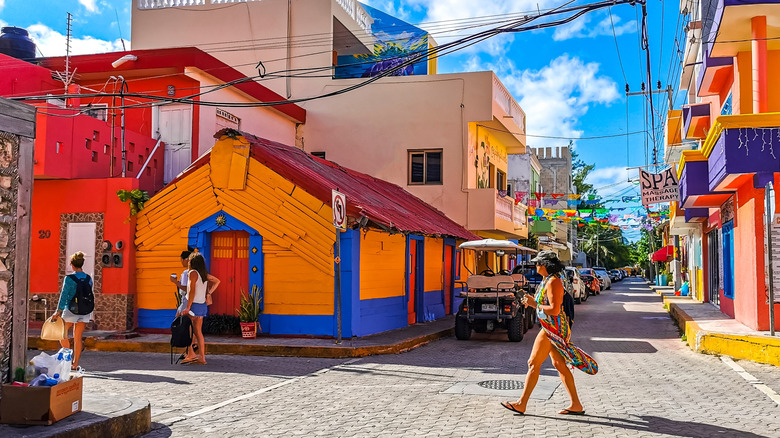 People walking down main street in El Centro Isla Mujeres, Mexico