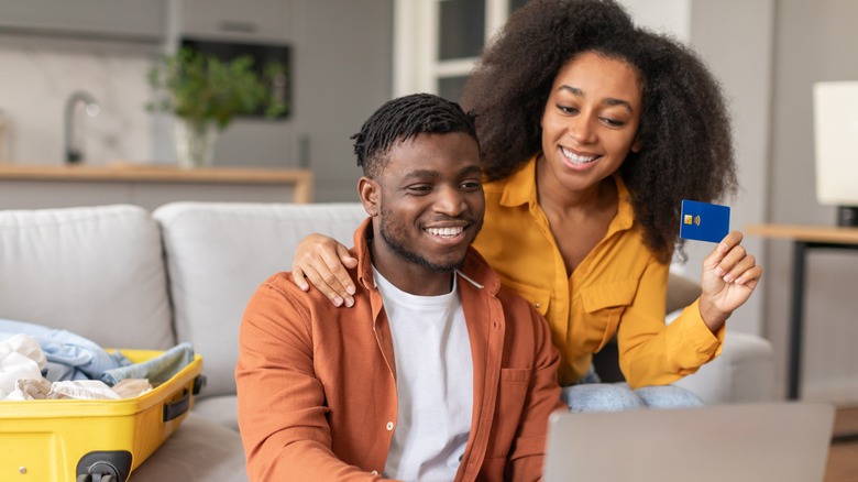 Couple on computer smiling