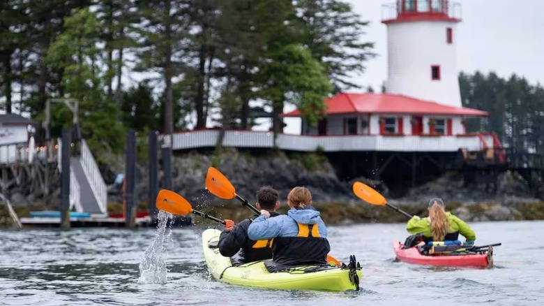 Kayakers paddling toward the Sitka Lighthouse