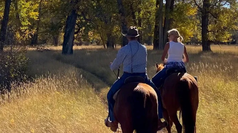 Guests horseback riding at Paws Up Montana