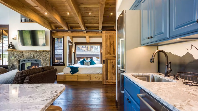 Kitchen, living area, and master bedroom at Snow Bear Chalets