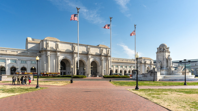 Outside of Union Station in Washington, D.C., with flags flying high