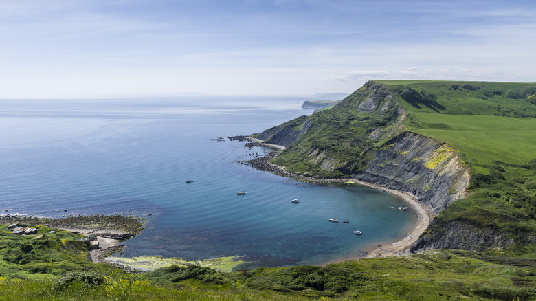 Green cliffs above bay