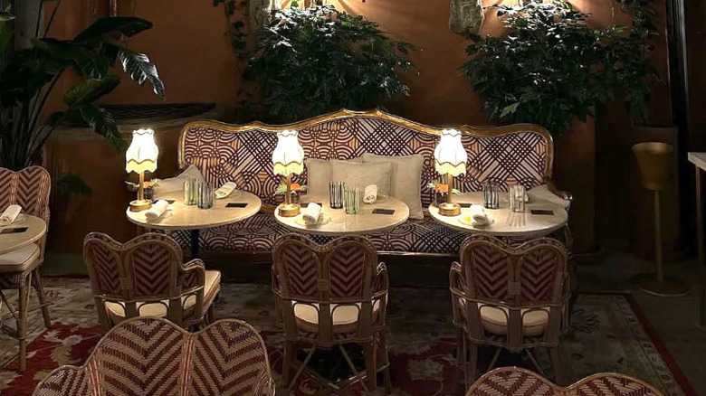 The on-site restaurant with evening lighting, at The James Suite Hotel Firenze 1594