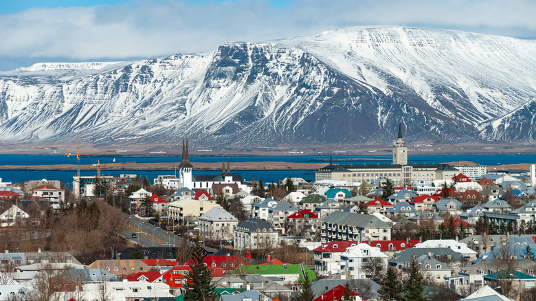 Buildings in Reykjavík, Iceland, against a snowy mountain landscape