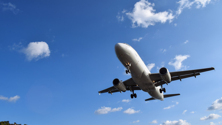View of an airplane against a blue sky