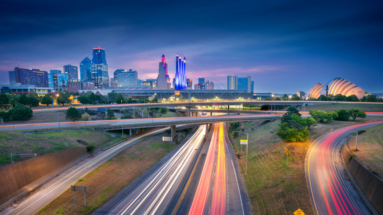 Kansas City skyline at night overlooking roadways, timelapse photo.