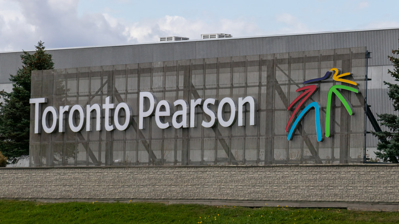 A large sign with Toronto Pearson airport logo