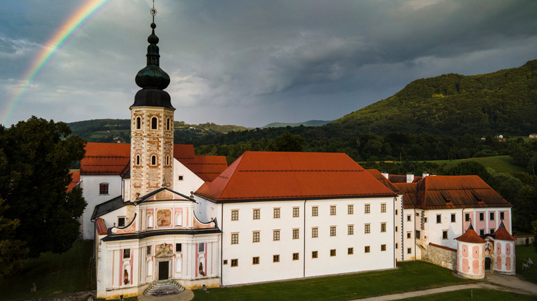 The Cistercian monastery in Kostanjevica na Krki, Slovenia, with a rainbow