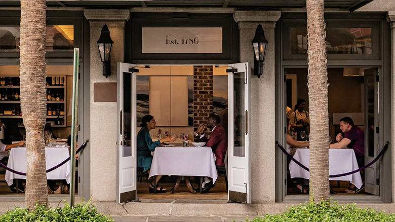 Exterior view of diners eating inside Revival in Charleston, South Carolina