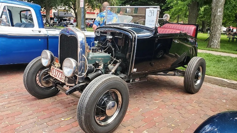 Vintage cars lined up around City Park during Stromsburg's Midsommar festival.