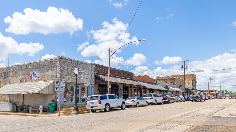 Old buildings in historic district with modern cars on the street