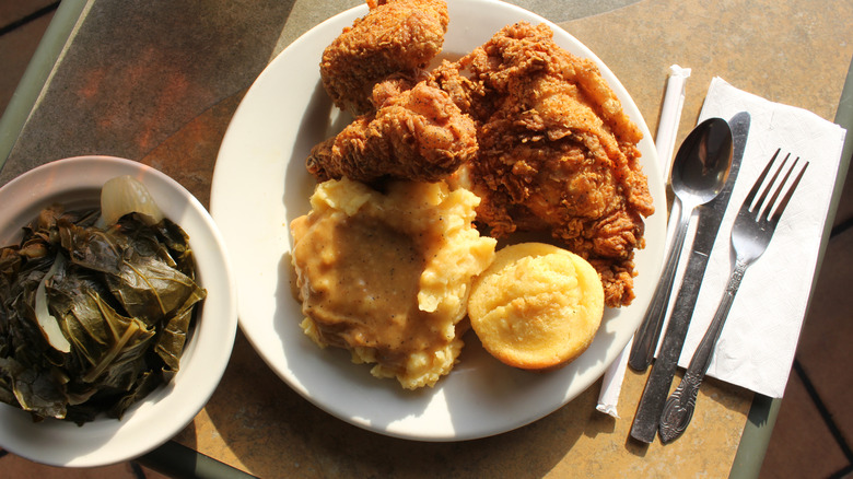 A restaurant dinner plate featuring Southern comfort food.