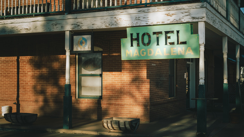 Magdalena Hall Hotel exterior with sign hanging