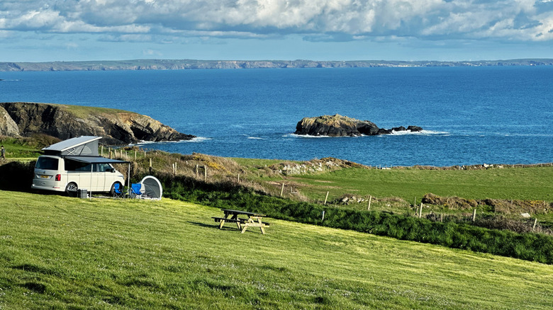 A campervan is parked alongside the Pembrokeshire coast near St Davids and Solva