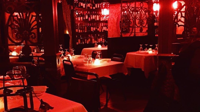 Red lighting and tables at Geja's Cafe