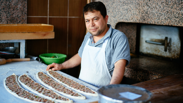 Cook preparing a traditional Turkish breakfast dish