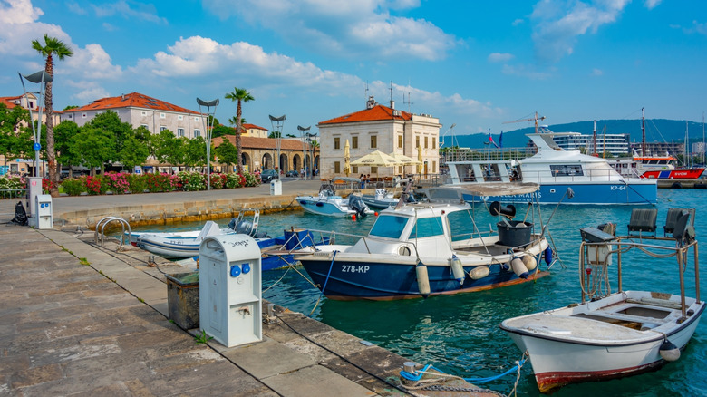 Boats mooring at dock in Koper, Slovenia on bright day