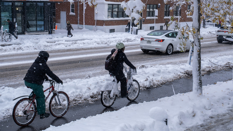 Two cyclists in the snow, Montreal, Canada