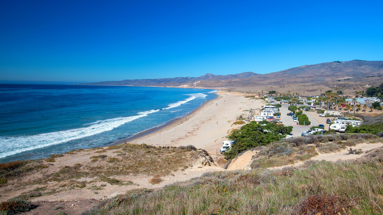 RVs parked in beachfront campsites at Jalama Beach County Park and Campground, near Santa Barbara, California.