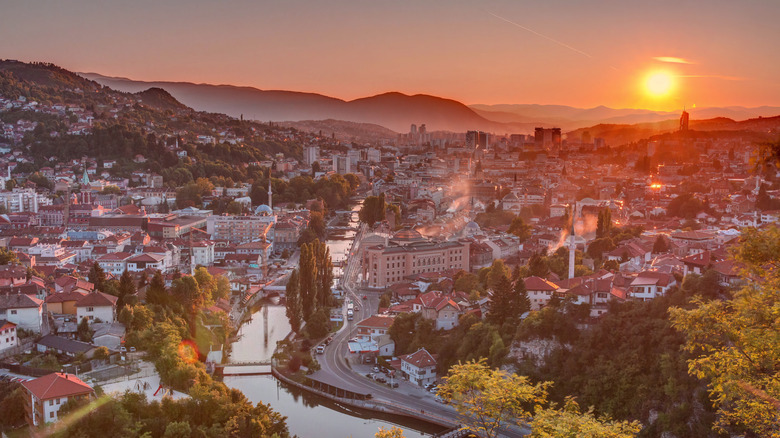 Panoramic view of Sarajevo at sunset with Miljacka river flowing through the center