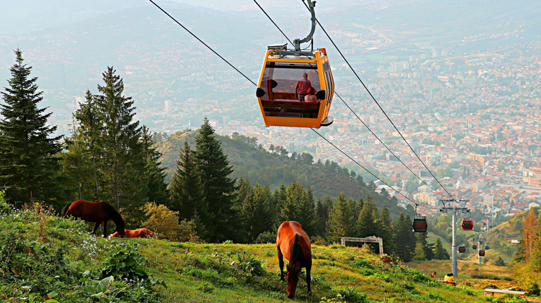 A cable car ascends Mount Trebevic funicular overlooking Sarajevo in Bosnia and Herzegovina