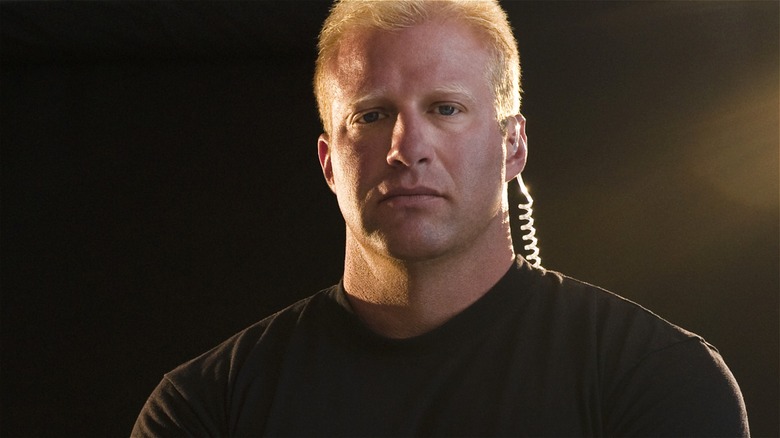 club bouncer blonde black shirt