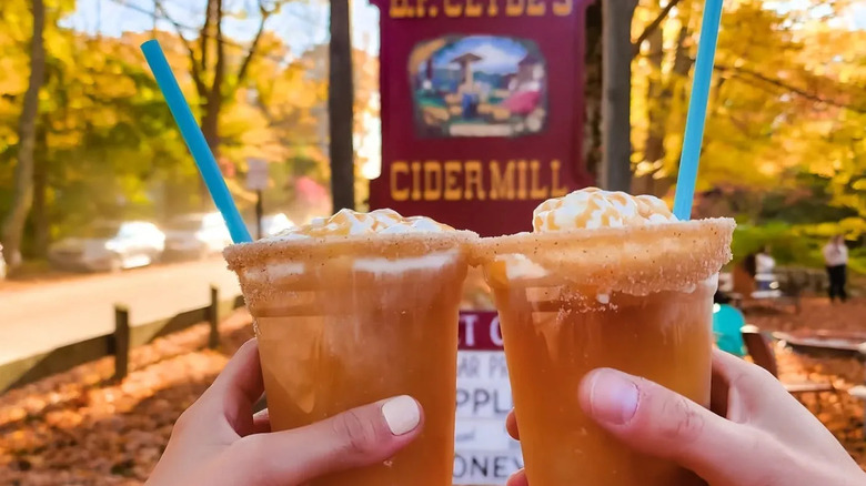 Toasting cider slushies at Clyde's Cider Mill in Mystic, Connecticut