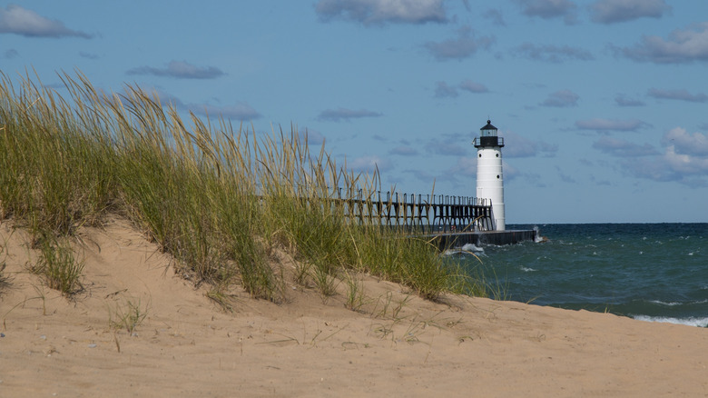 Manistee North Pier Lighthouse with sandy shores