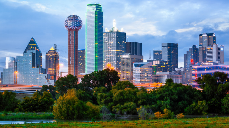 Dallas skyline in the evening with park in foreground.