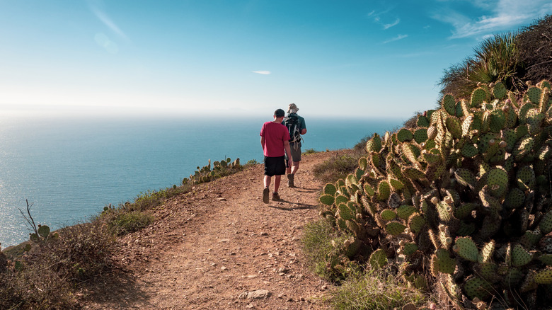 Two people hiking at Point Mugu State Park, Malibu, California