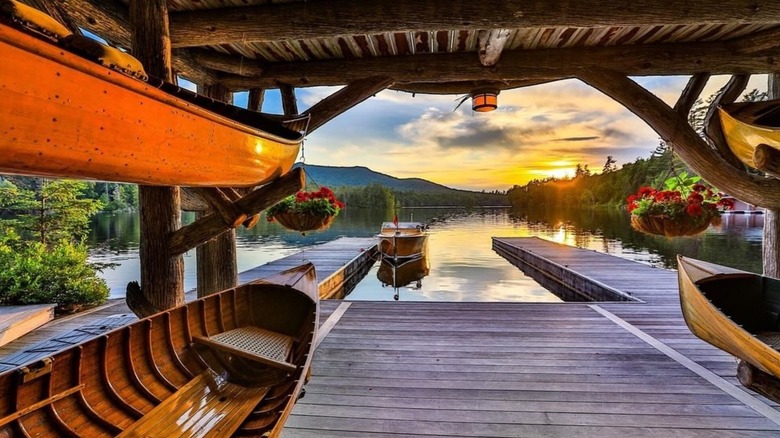 Canoes in boathouse at Upper St. Regis Lake camp